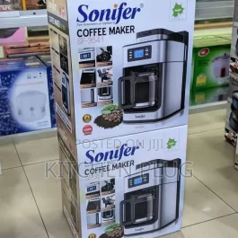 Coffee maker with grinder